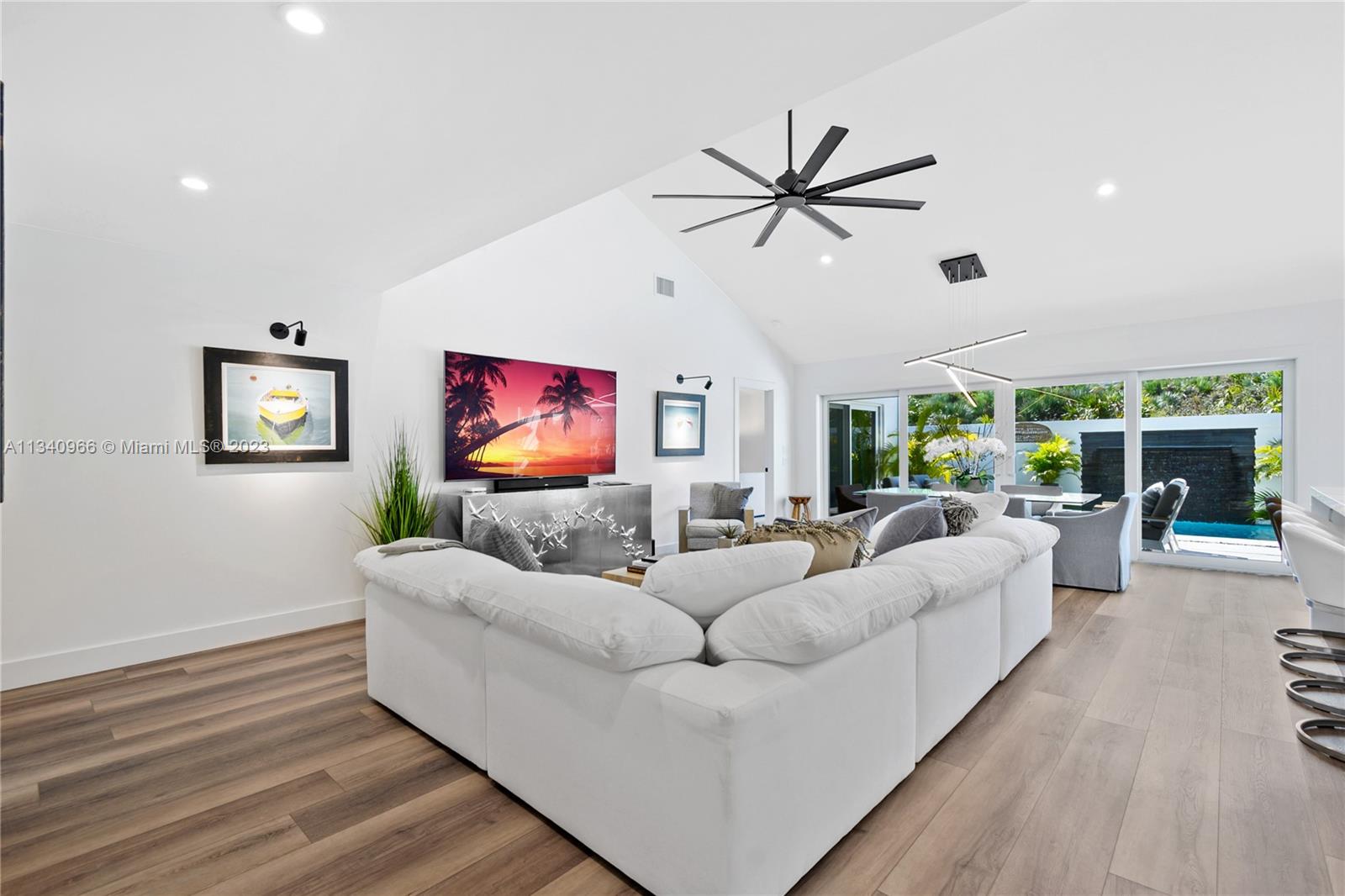 136 Sand Pine Drive Jupiter, FL 33477 - Photo 6 of 30 a living room with furniture and a fireplace