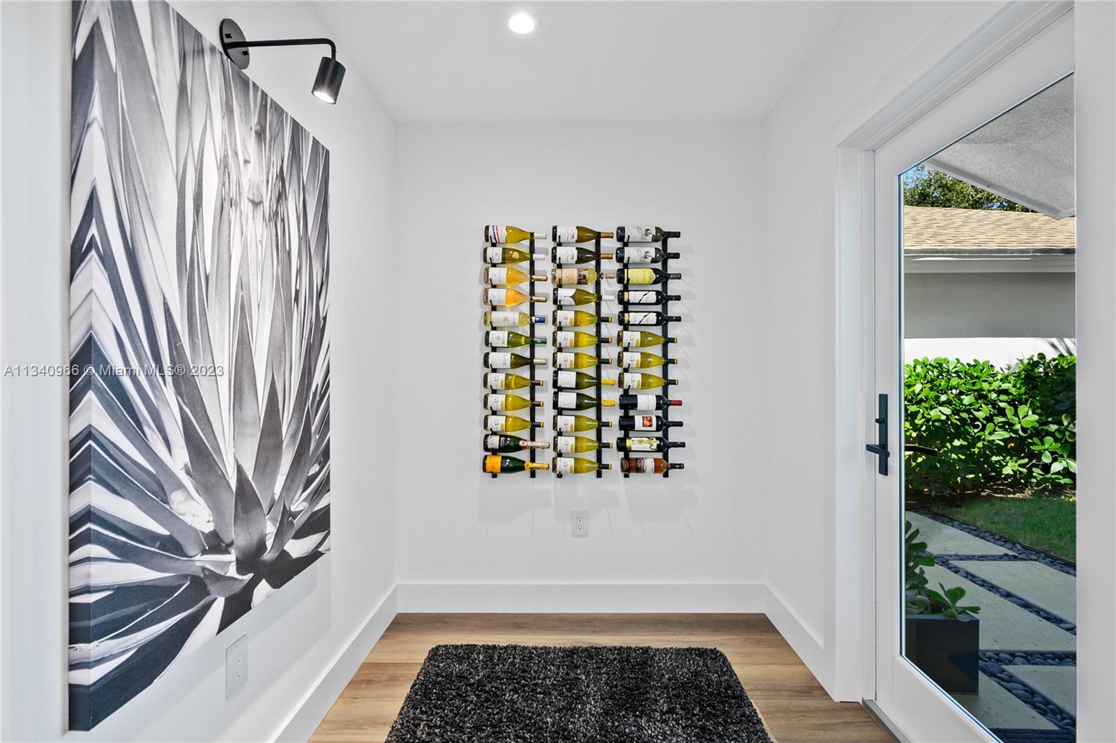 136 Sand Pine Drive Jupiter, FL 33477 - Photo 8 of 30 a bathroom with a sink and a window