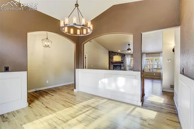 a view of a hallway with chandelier