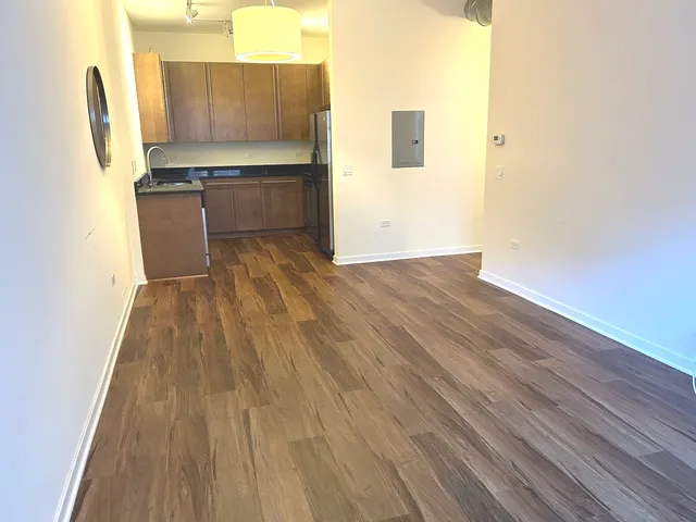 a view of kitchen with wooden floor