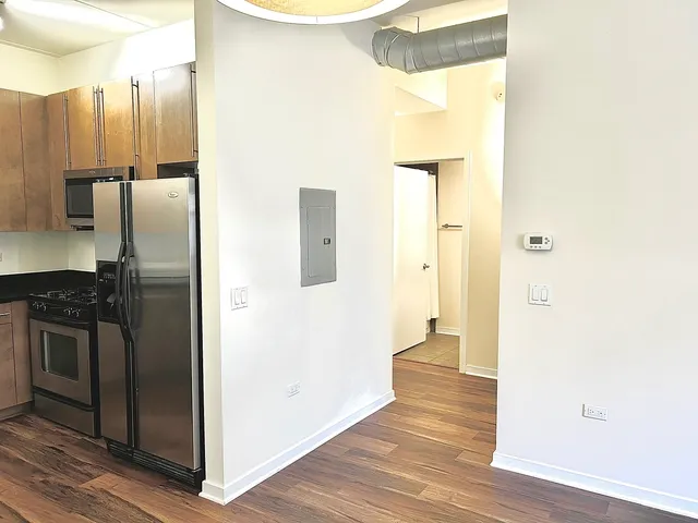 a view of a kitchen from the hallway
