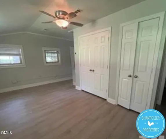 a view of an empty room and a window