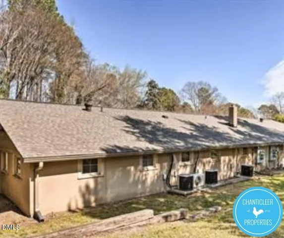 a view of a swimming pool with an outdoor seating