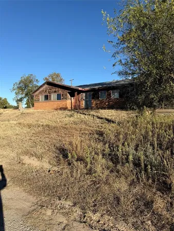 a view of a backyard of the house