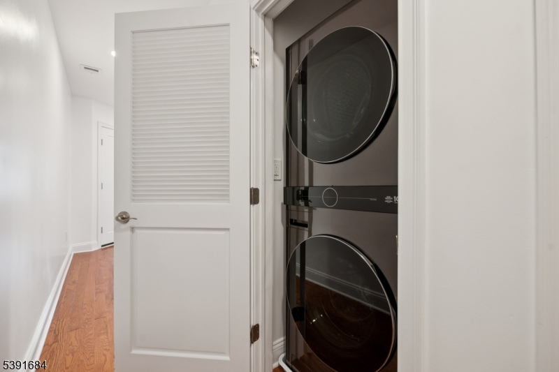 915 Main Street, Unit 2R Boonton, NJ 07005 - Photo 13 of 19 a close view of a utility room with dryer and washer