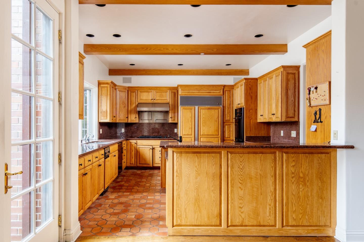 3210 Macomber Drive Pebble Beach, CA 93953 - Photo 12 of 14 a view of a large kitchen with a window
