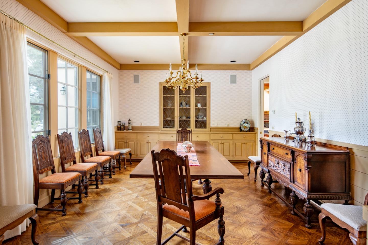 3210 Macomber Drive Pebble Beach, CA 93953 - Photo 5 of 14 a living room with furniture a chandelier and a flat screen tv