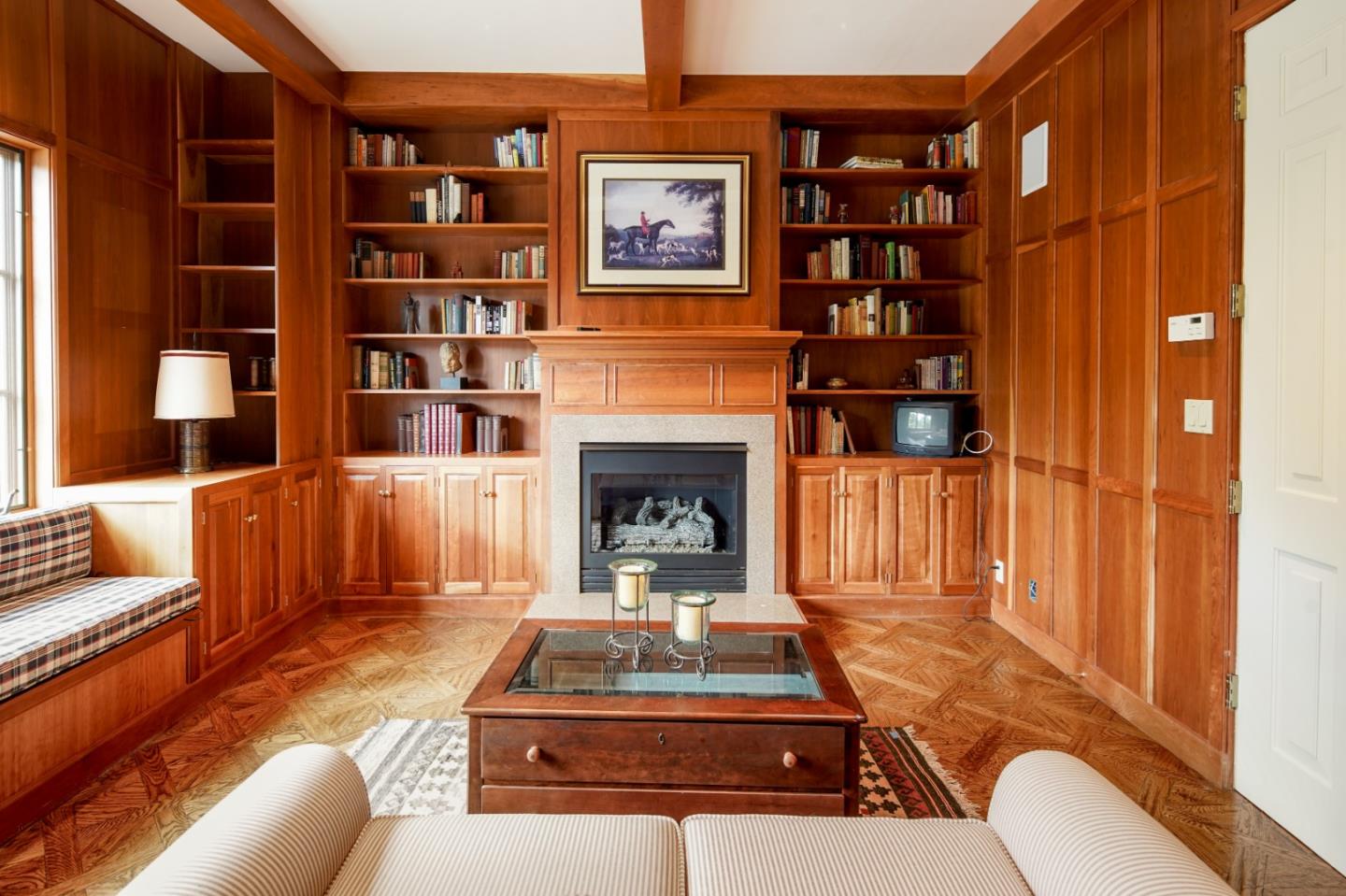 3210 Macomber Drive Pebble Beach, CA 93953 - Photo 6 of 14 a living room with furniture a rug and a fireplace