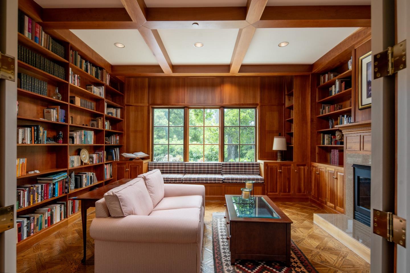 3210 Macomber Drive Pebble Beach, CA 93953 - Photo 7 of 14 a living room with furniture and a book shelf