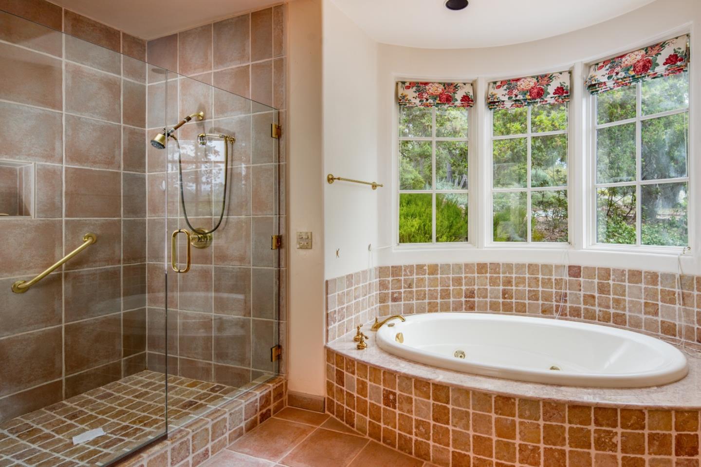 3210 Macomber Drive Pebble Beach, CA 93953 - Photo 10 of 14 a bathroom with a bathtub and a shower