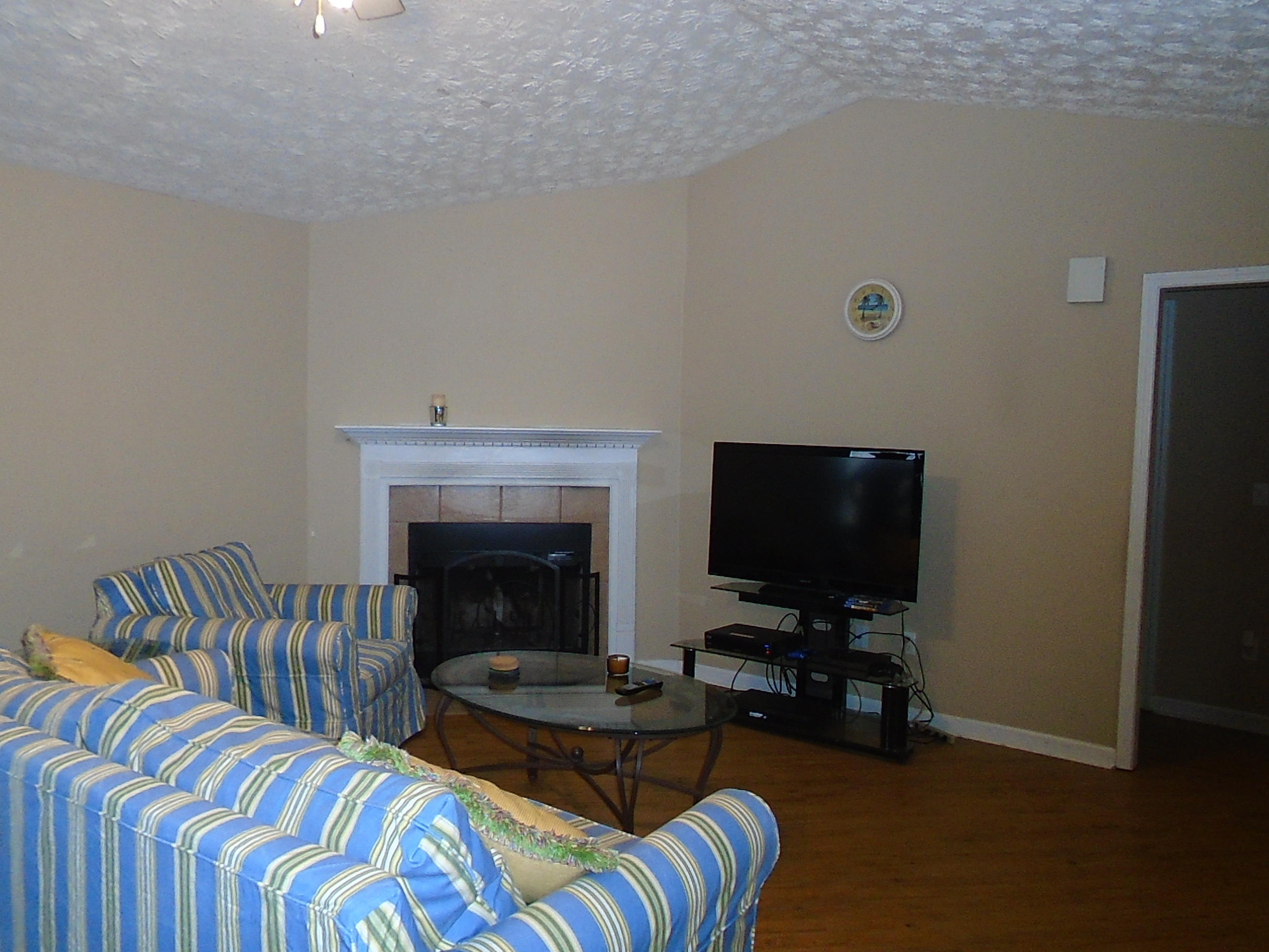 87 Tropical Way Freeport, FL 32439 - Photo 2 of 12 a living room with furniture and a fireplace