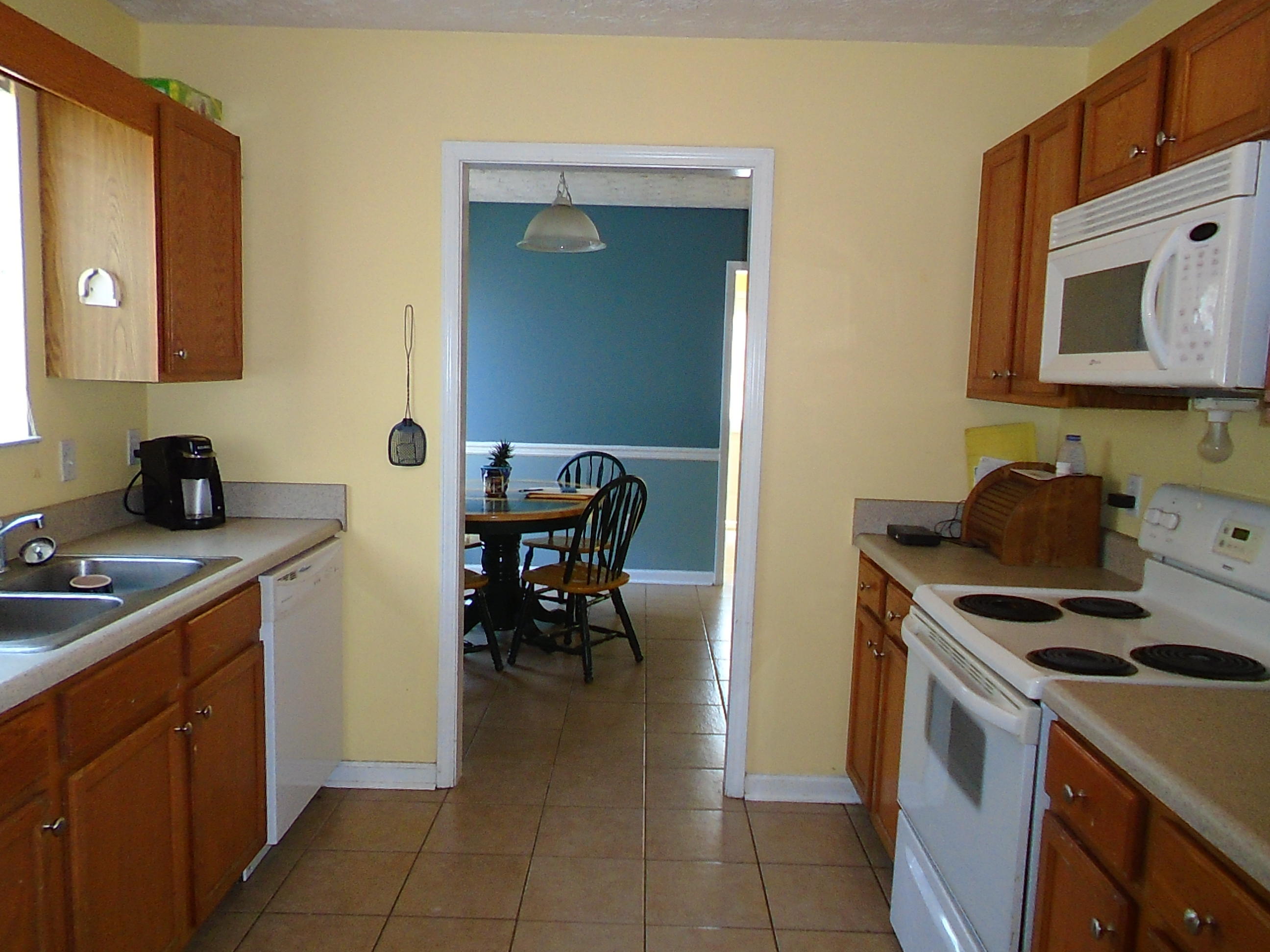 87 Tropical Way Freeport, FL 32439 - Photo 3 of 12 a kitchen with a stove and a sink