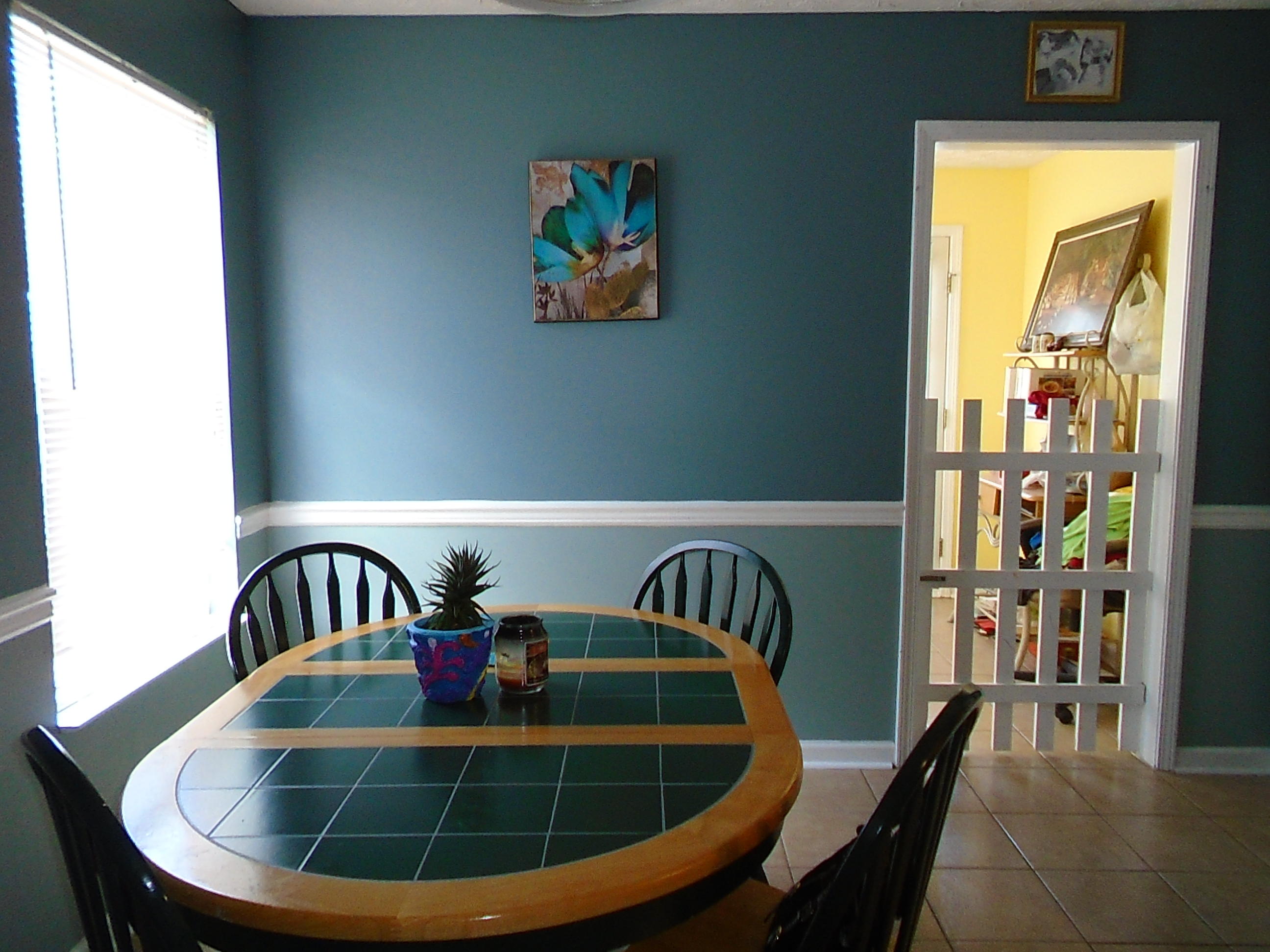 87 Tropical Way Freeport, FL 32439 - Photo 4 of 12 a view of a dining room with furniture window and wooden floor