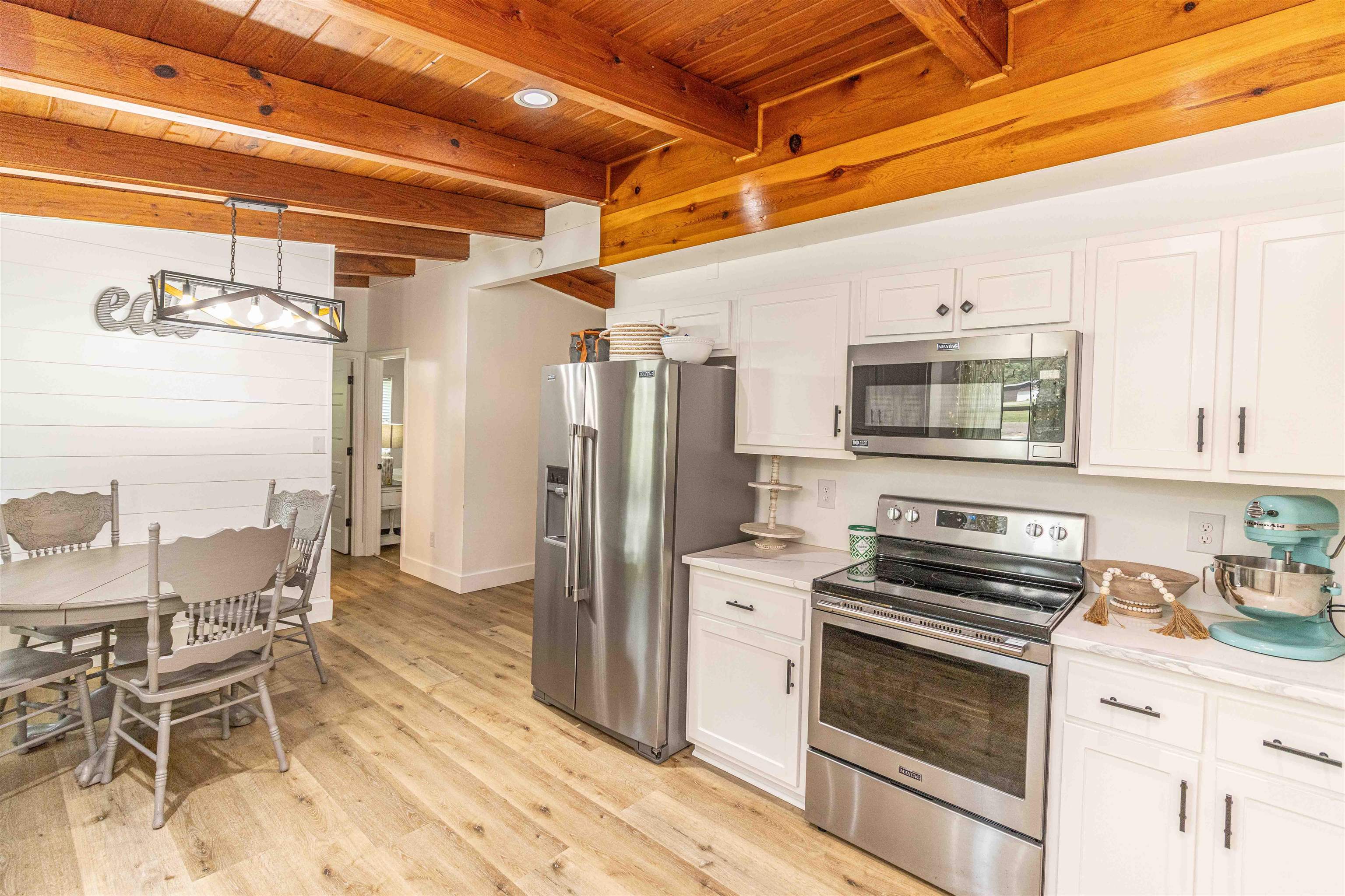 3285 Highway 57 Ramer, TN 38367 - Photo 11 of 22 a kitchen with stainless steel appliances a stove a sink and a refrigerator