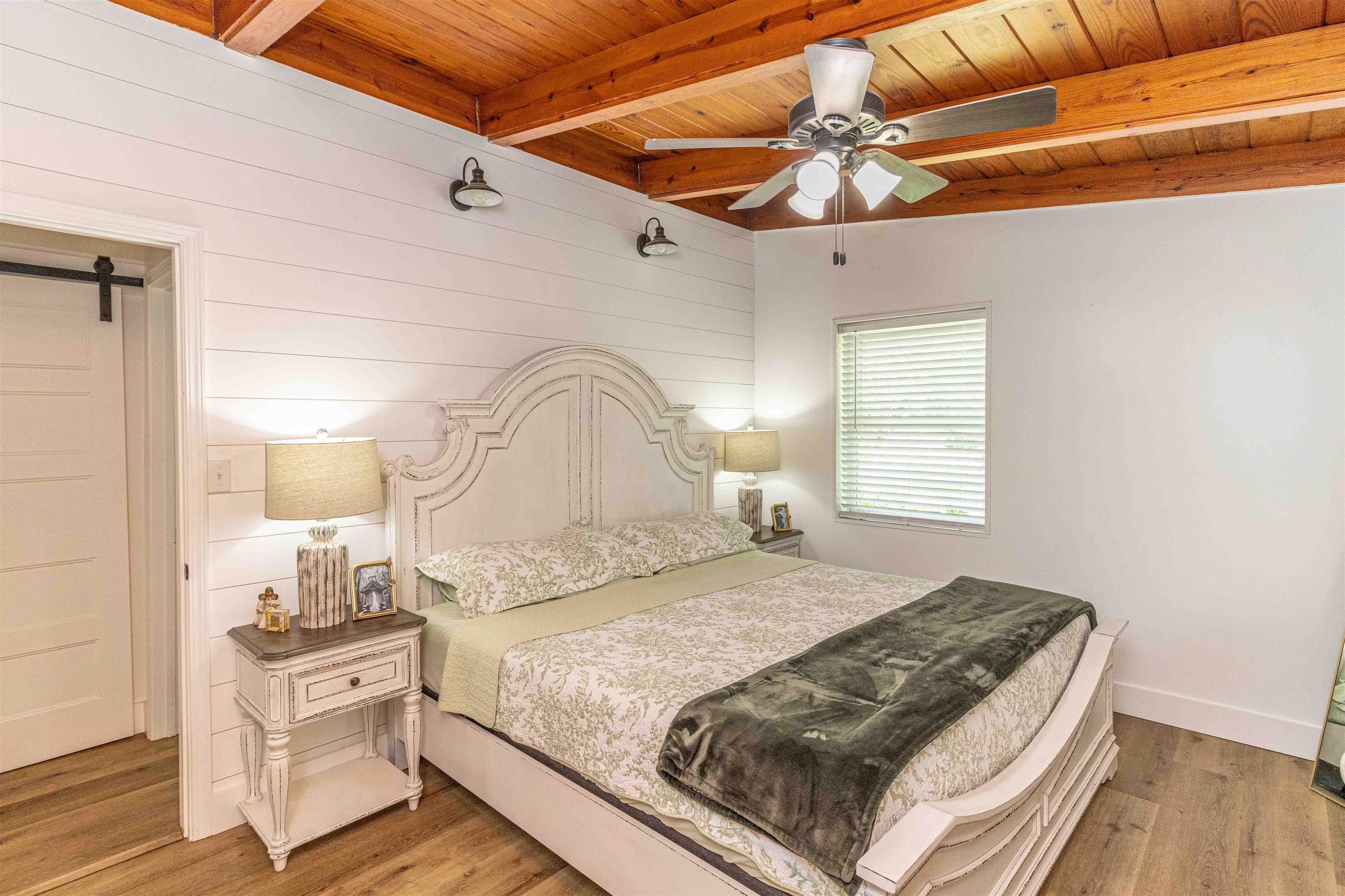 3285 Highway 57 Ramer, TN 38367 - Photo 12 of 22 a bedroom with a bed and a chandelier