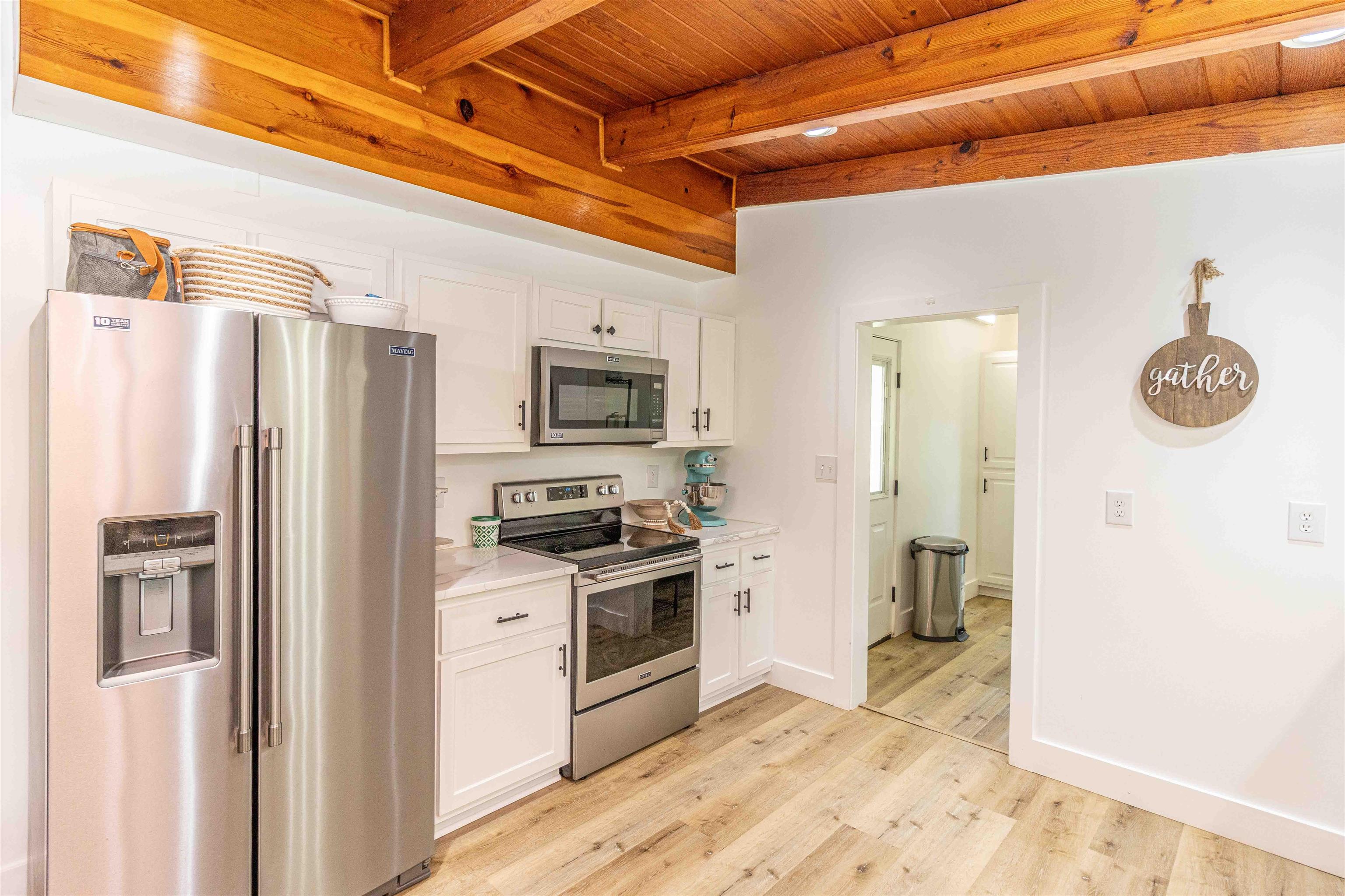 3285 Highway 57 Ramer, TN 38367 - Photo 8 of 22 a kitchen with stainless steel appliances granite countertop a refrigerator a stove and a sink with granite countertops