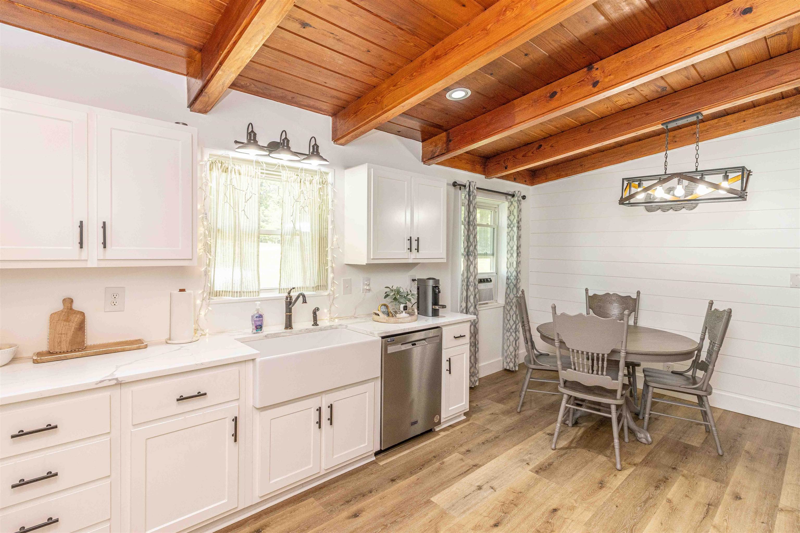 3285 Highway 57 Ramer, TN 38367 - Photo 10 of 22 a kitchen with a sink and chairs