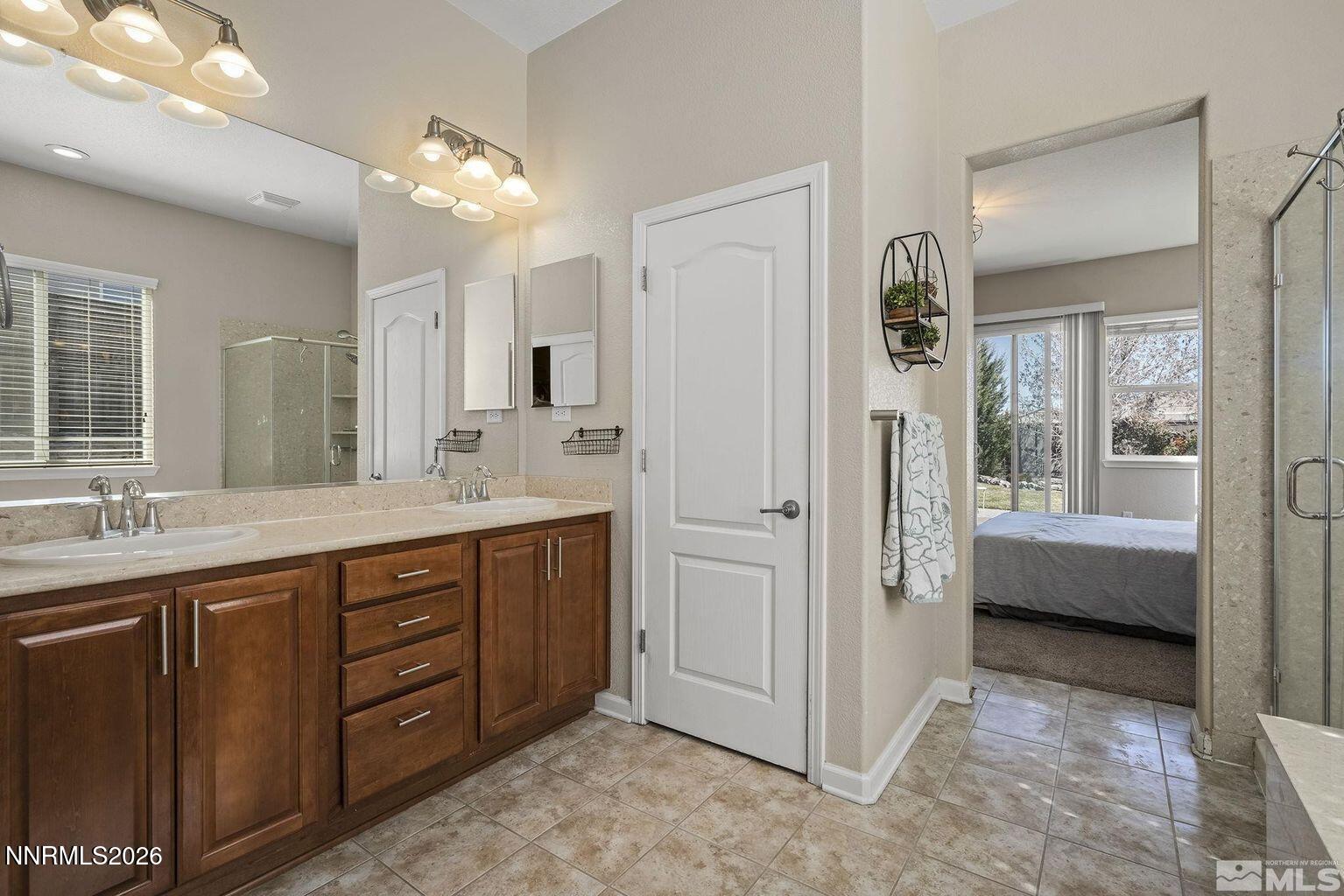 735 Sienna Park Drive Reno, NV 89512 - Photo 14 of 24 a spacious bathroom with a tub sink and mirror