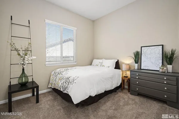 a bedroom with a bed and a table