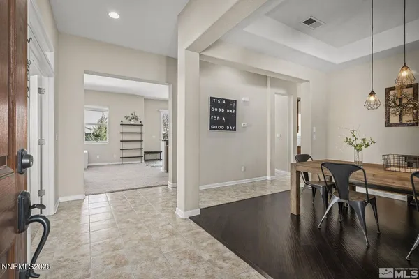 a view of a livingroom with furniture window and wooden floor