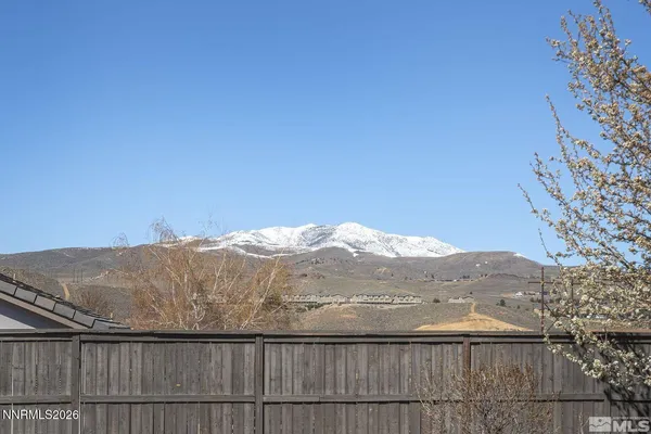 a view of a mountain from a balcony