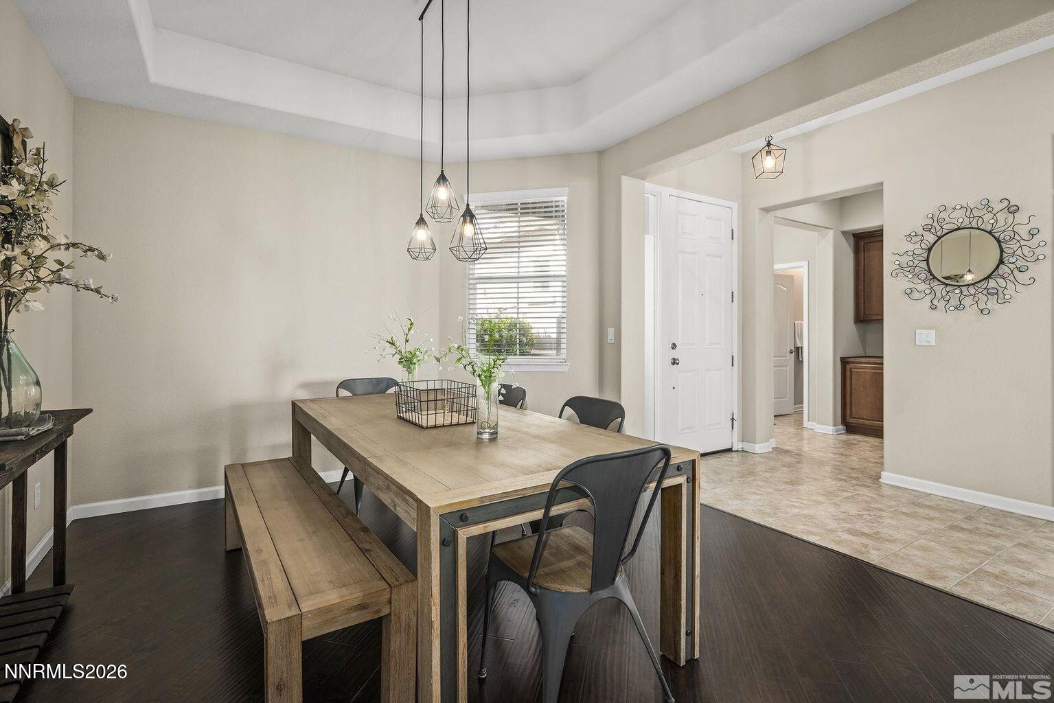 735 Sienna Park Drive Reno, NV 89512 - Photo 3 of 24 a view of a dining room with furniture and wooden floor
