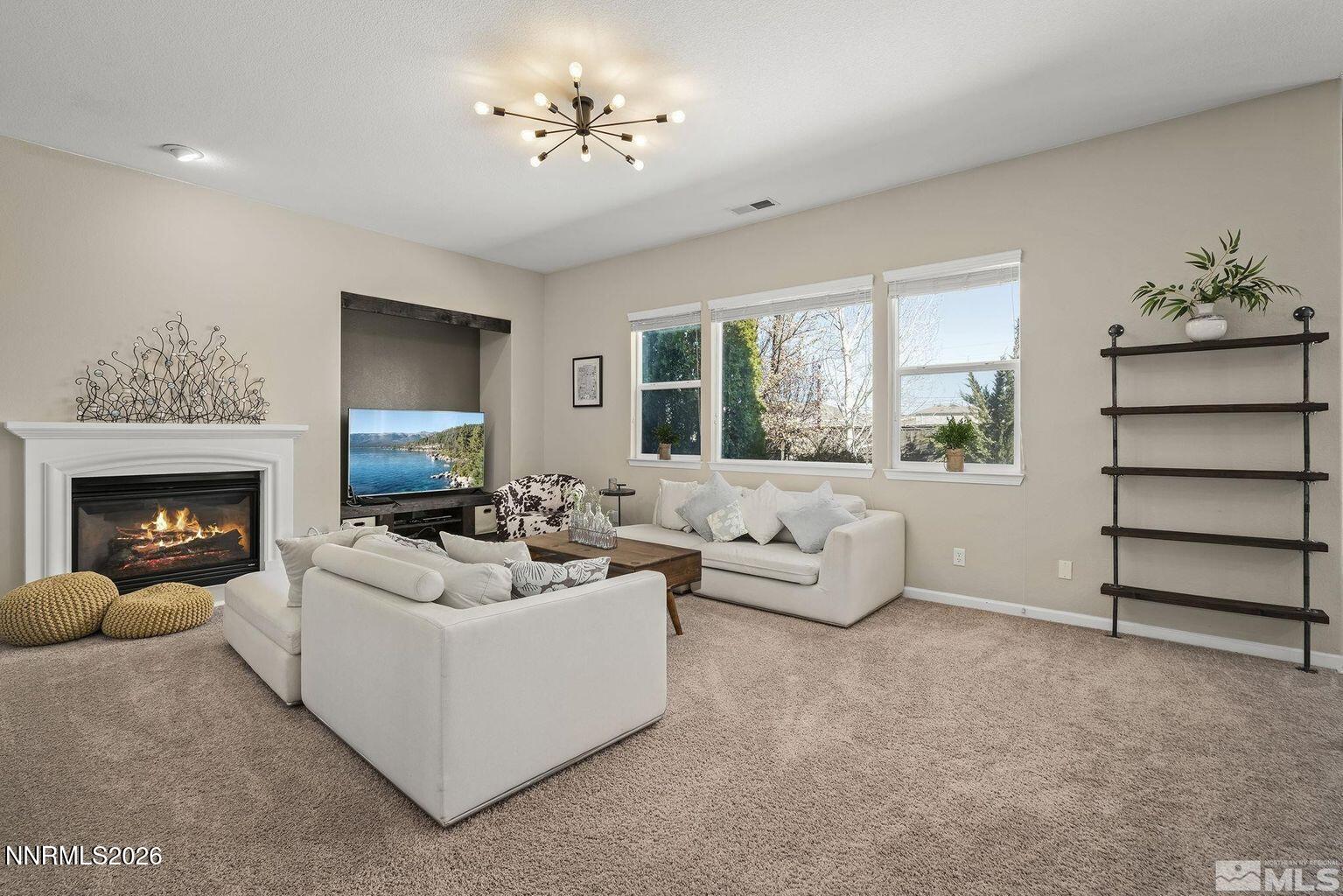 735 Sienna Park Drive Reno, NV 89512 - Photo 4 of 24 a living room with furniture and a fireplace