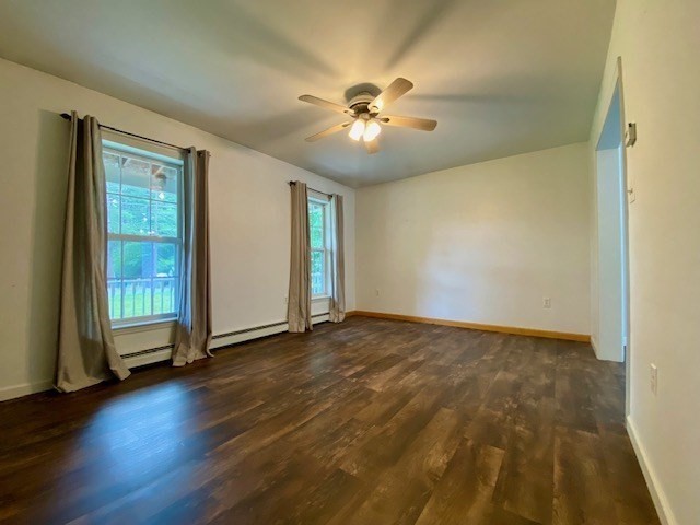 39 Eagleville Road Orange, MA 01364 - Photo 8 of 41 a view of an empty room with wooden floor and a window