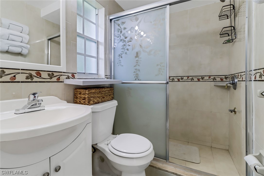 1192 Moody Road North Fort Myers, FL 33903 - Photo 19 of 29 a bathroom with a sink a toilet and shower