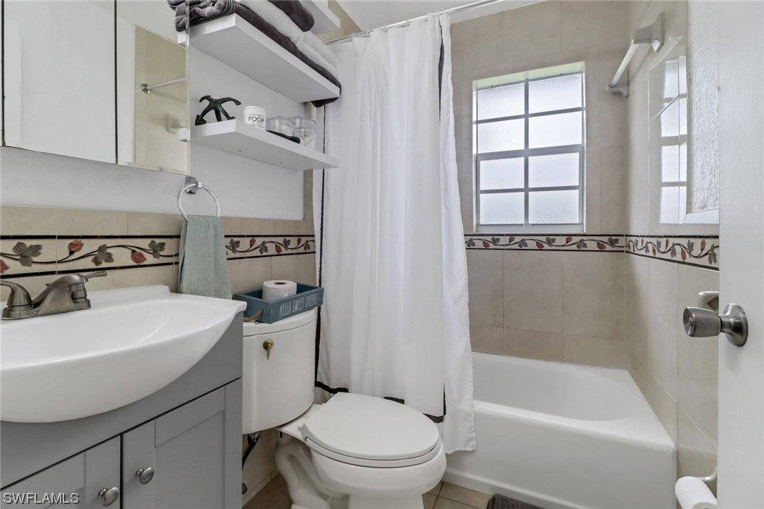 1192 Moody Road North Fort Myers, FL 33903 - Photo 22 of 29 a bathroom with a sink a toilet and bathtub