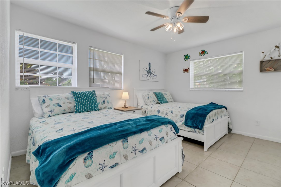 1192 Moody Road North Fort Myers, FL 33903 - Photo 24 of 29 a bedroom with bed and window