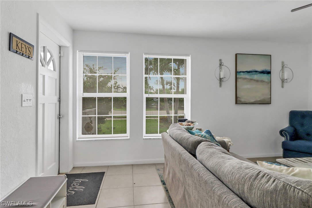 1192 Moody Road North Fort Myers, FL 33903 - Photo 5 of 29 a living room with furniture and a window