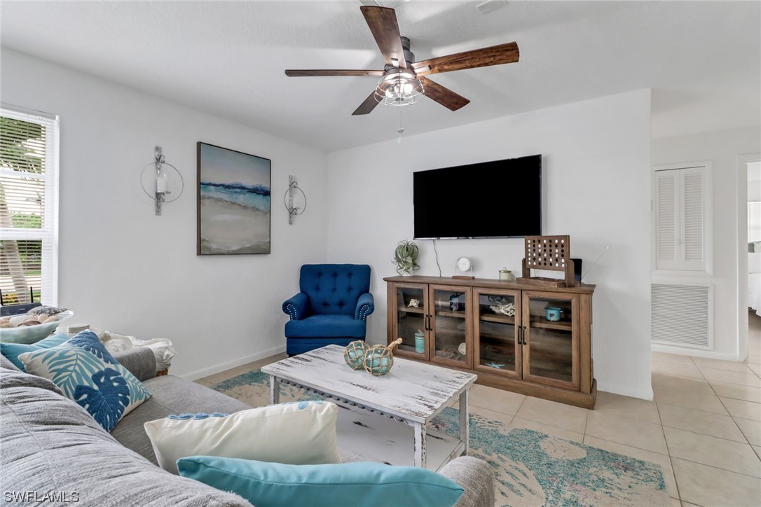 1192 Moody Road North Fort Myers, FL 33903 - Photo 6 of 29 a living room with furniture and a flat screen tv