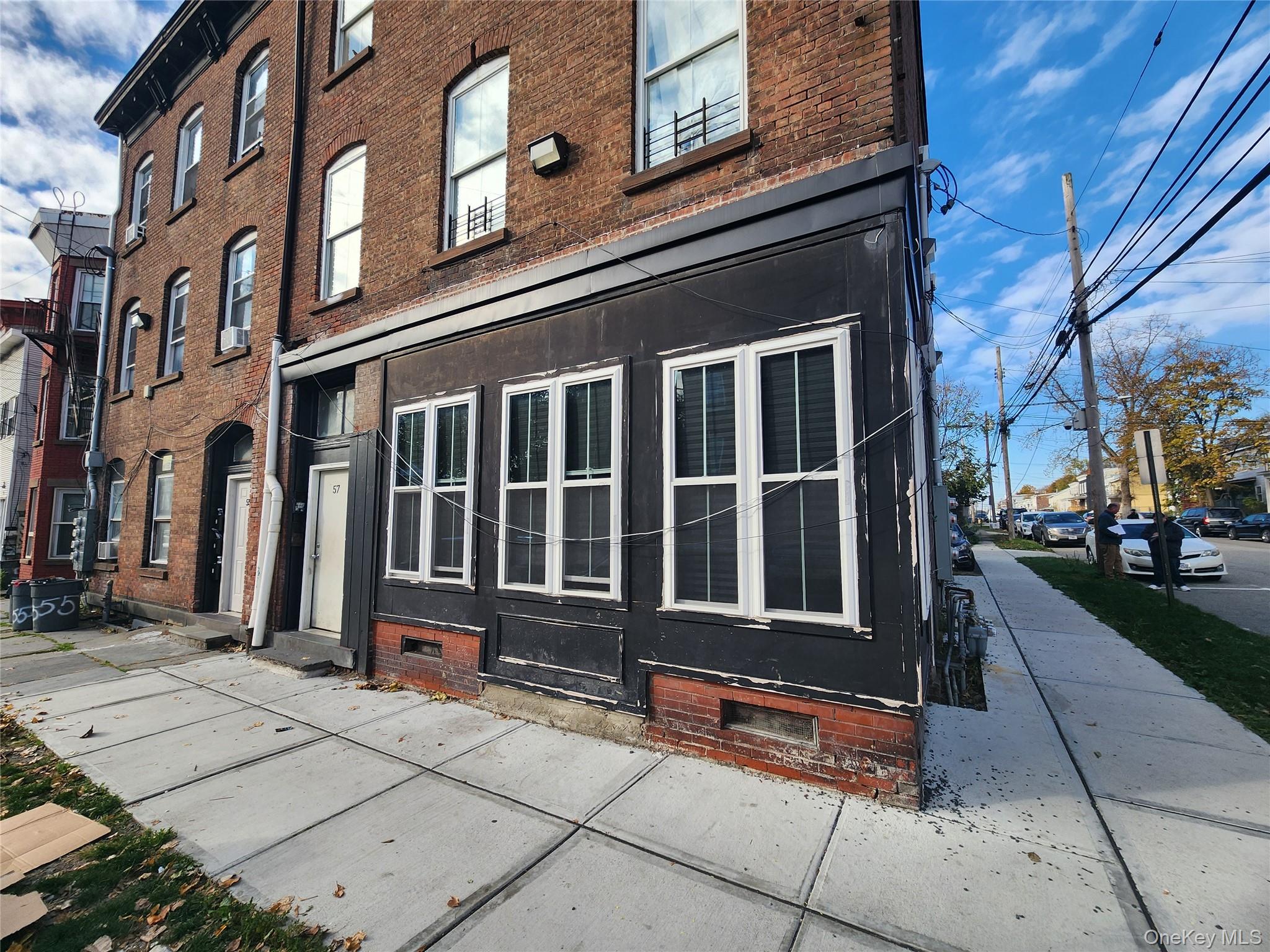 57 Carpenter Avenue Newburgh, NY 12550 - Photo 1 of 16 front view of a brick building