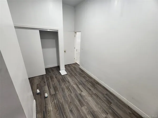 an empty room with wooden floor