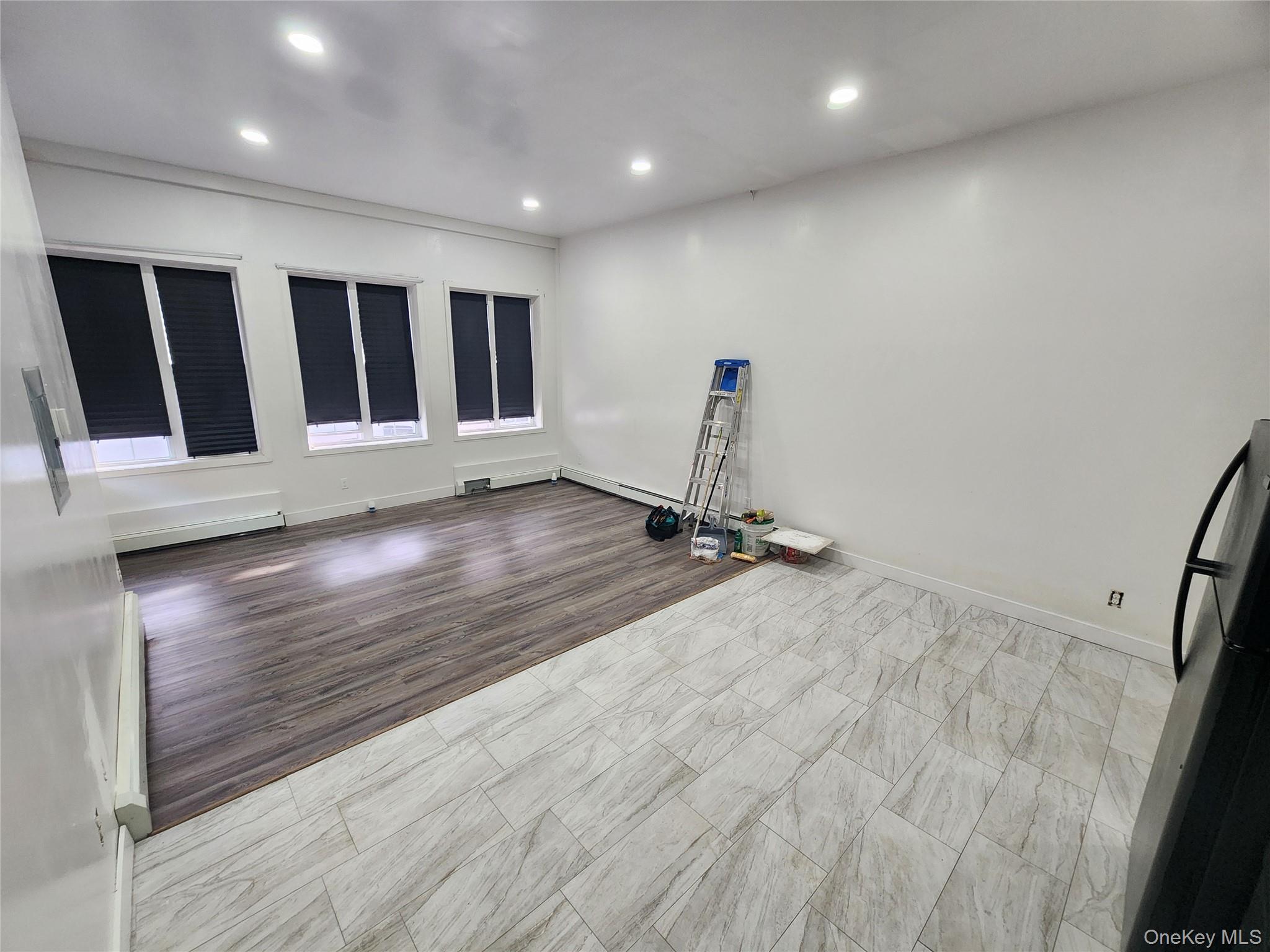 57 Carpenter Avenue Newburgh, NY 12550 - Photo 6 of 16 a view of a room with wooden floor and window
