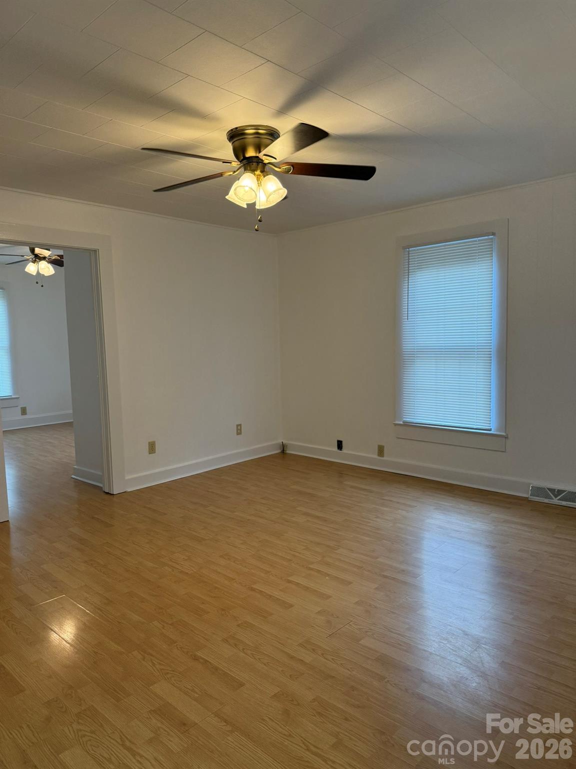 108 Fletcher Street Morganton, NC 28655 - Photo 9 of 29 a view of a room with wooden floor and ceiling fan