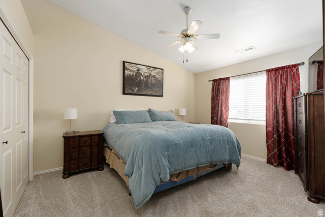 161 West 950 South, Unit S4 St. George, UT 84770 - Photo 13 of 21 Bedroom featuring vaulted ceiling, ceiling fan, light carpet, and a closet
