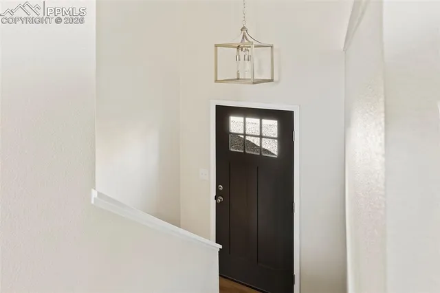 a view of a hallway with a white walls