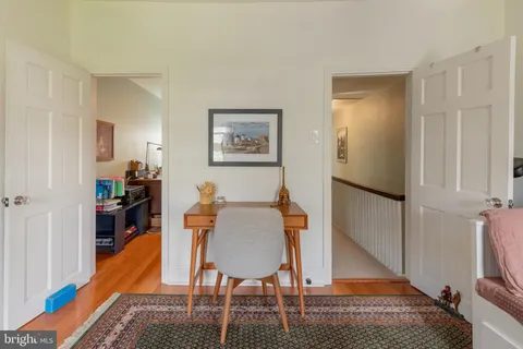 a workspace with furniture and wooden floor