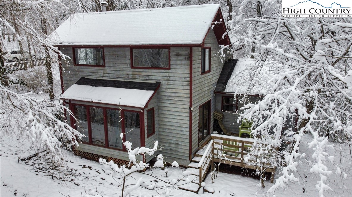 1355 Pine Run Road Boone, NC 28607 - Photo 1 of 37 a view of a house with backyard and sitting area