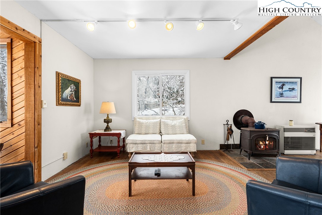 1355 Pine Run Road Boone, NC 28607 - Photo 12 of 37 a living room with furniture a rug and a window