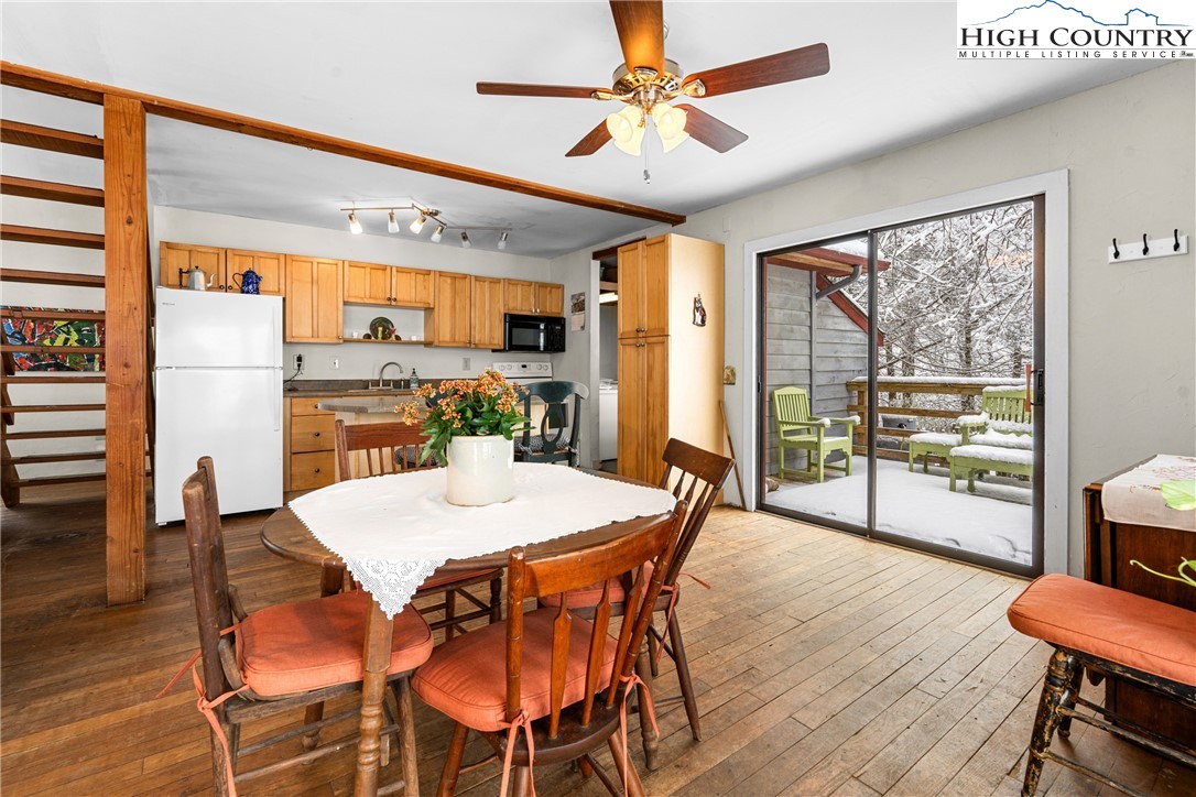 1355 Pine Run Road Boone, NC 28607 - Photo 13 of 37 a view of a dining room with furniture window and wooden floor