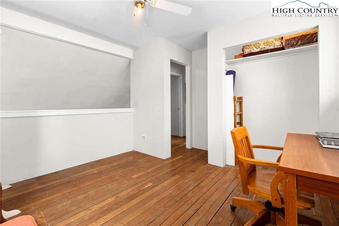 1355 Pine Run Road Boone, NC 28607 - Photo 16 of 37 a workspace with wooden floor and windows