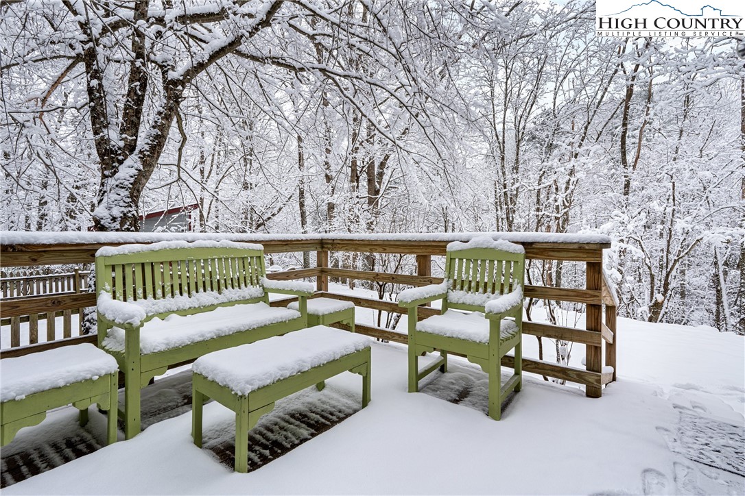 1355 Pine Run Road Boone, NC 28607 - Photo 22 of 37 a view of a chairs and tables in the roof deck