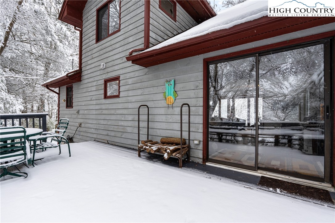 1355 Pine Run Road Boone, NC 28607 - Photo 26 of 37 a view of a patio with table and chairs