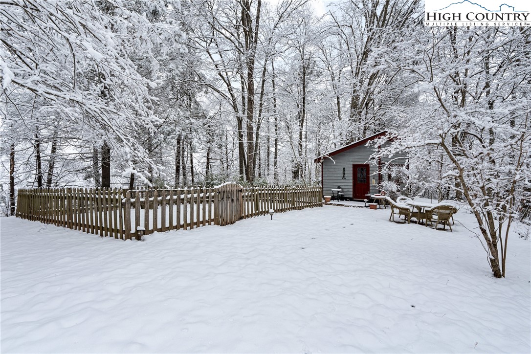 1355 Pine Run Road Boone, NC 28607 - Photo 29 of 37 a view of a trees and car parked in front of house