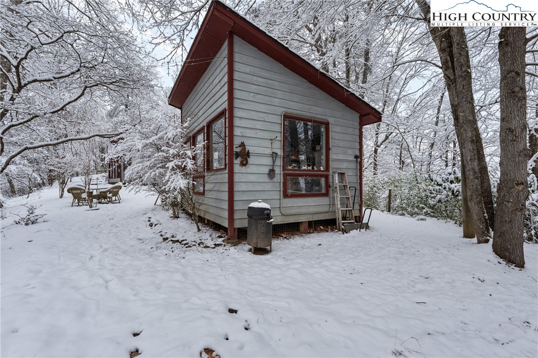 1355 Pine Run Road Boone, NC 28607 - Photo 33 of 37 a view of backyard with wooden fence and large trees