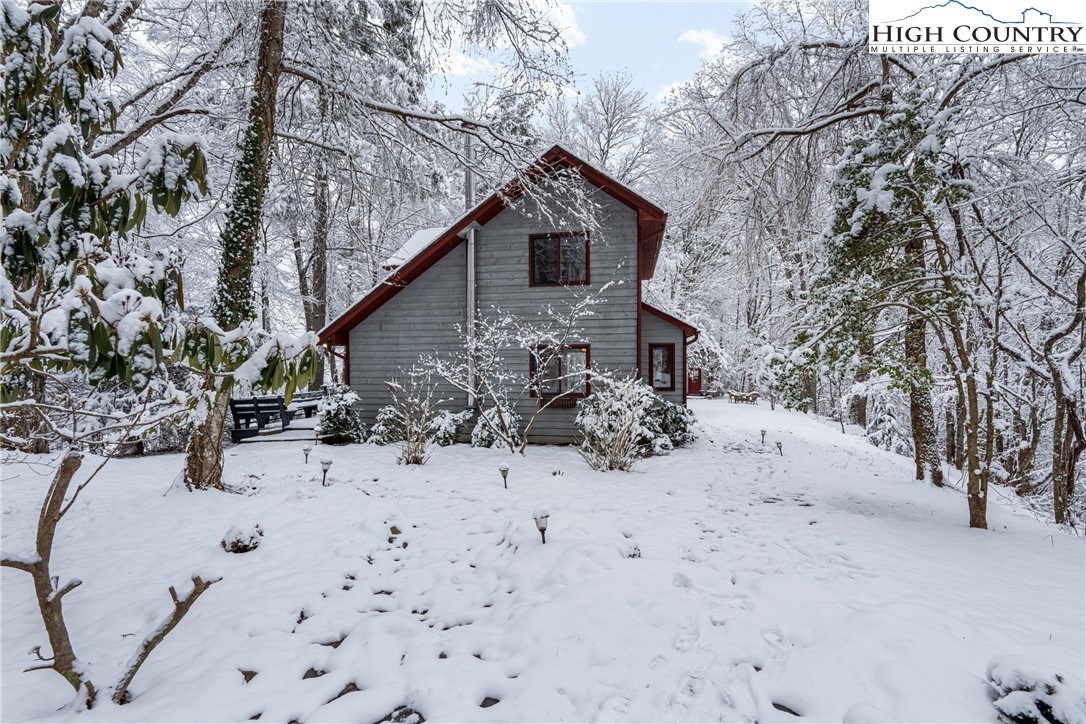 1355 Pine Run Road Boone, NC 28607 - Photo 34 of 37 a view of a house covered in snow
