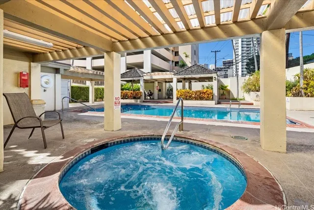a view of a swimming pool with a patio